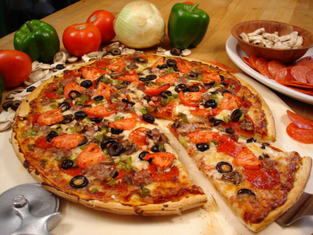 Pizza Being Sliced